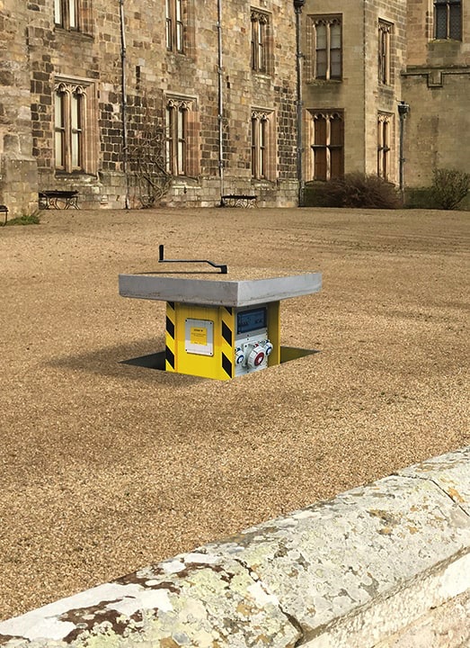 Image of an in-ground unt with the hinged lid open